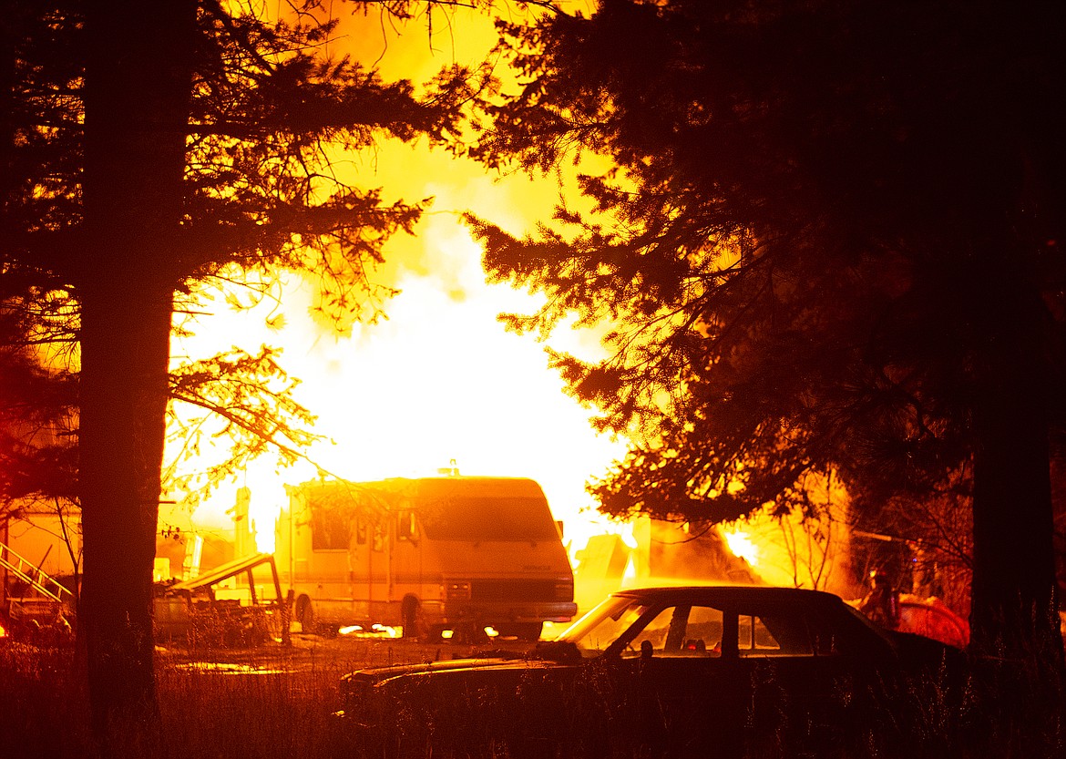 An RV is fully engulfed in flames in an early morning fire on Falcon Lane. (Chris Peterson photo)