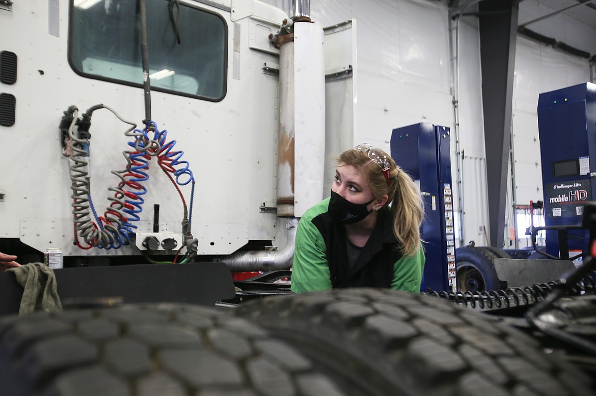 Mel Andrews works on a truck in North Idaho College's diesel tech program at the Parker Technical Education Campus on March 9. A single mother of five, Andrews is determined to learn a trade to be self-sufficient and make enough money to support her family.