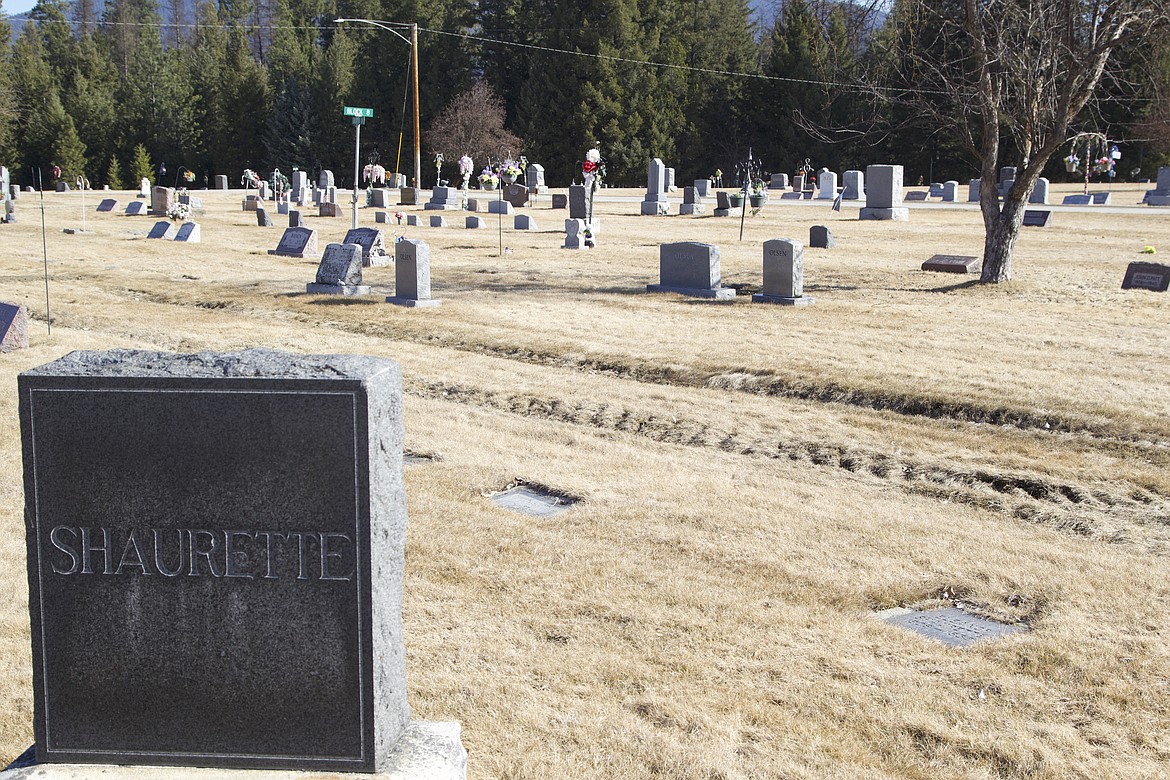 Deep tire ruts could be seen above graves at the Libby Cemetery March 16. (Will Langhorne/The Western News)