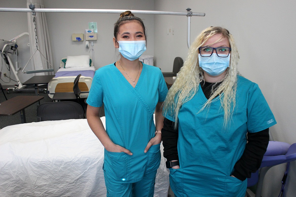 Mariane Bustarde (left) and Christal Champagne-Cave are pictured in one of the classrooms at the North Idaho College Workforce Training Center. They both work at Life Care Center of Post Falls and are in the Registered CNA Apprenticeship program.