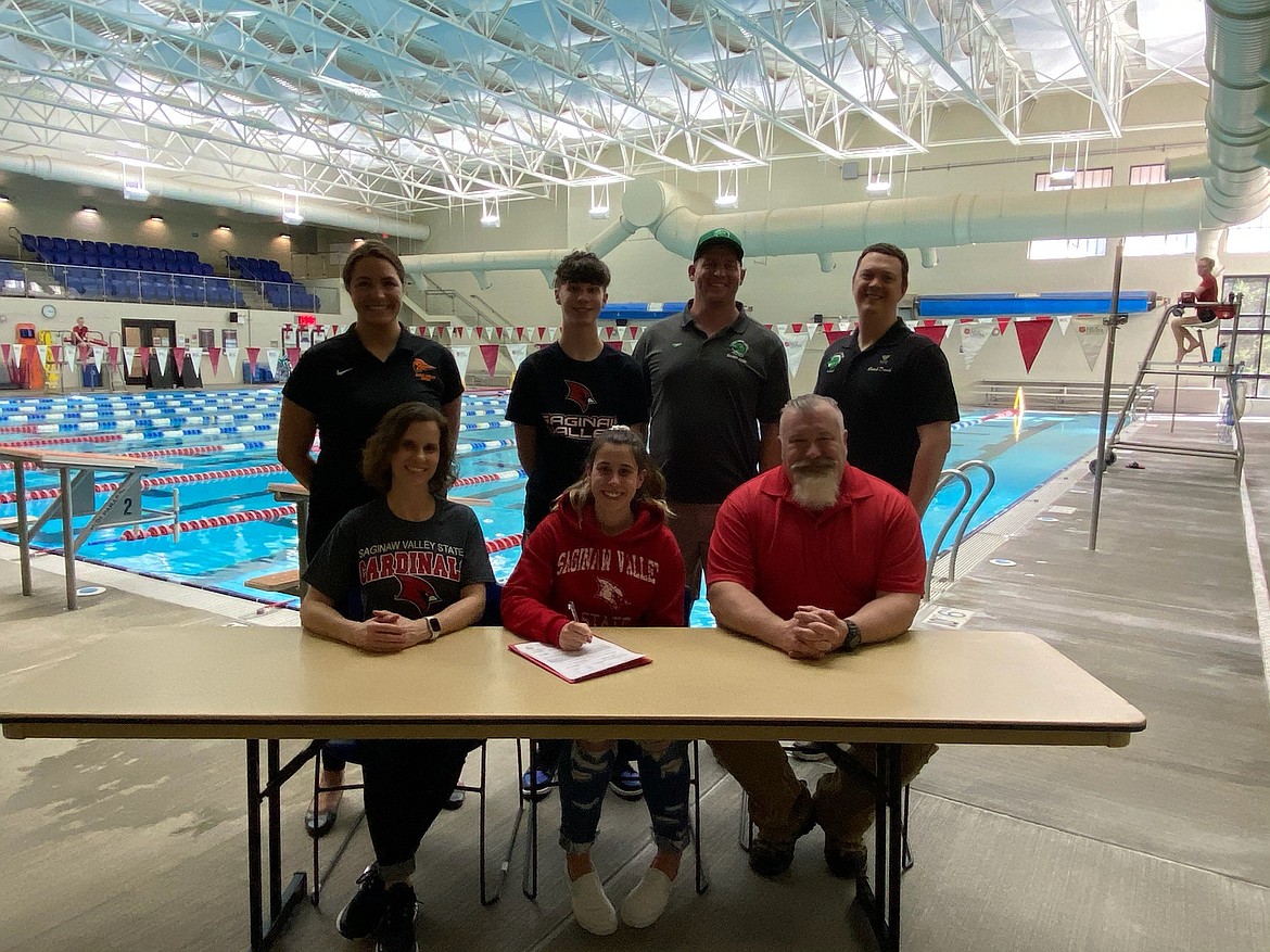 Courtesy photo
Post Falls High senior Natasha Astrauskas recently signed a letter of intent to swim at NCAA Division II Saginaw Valley State University in University Center, Mich. Seated from left are Krista Astrauskas, mom; Natasha Astrauskas and Chris Astrauskas, dad; and standing from left, Jessica Watkins, Post Falls High swimming coach; Quentin Astruaskas, brother; Jade Sobek, coach; and David Dolphay, Coeur d'Alene Area Swim Team coach.