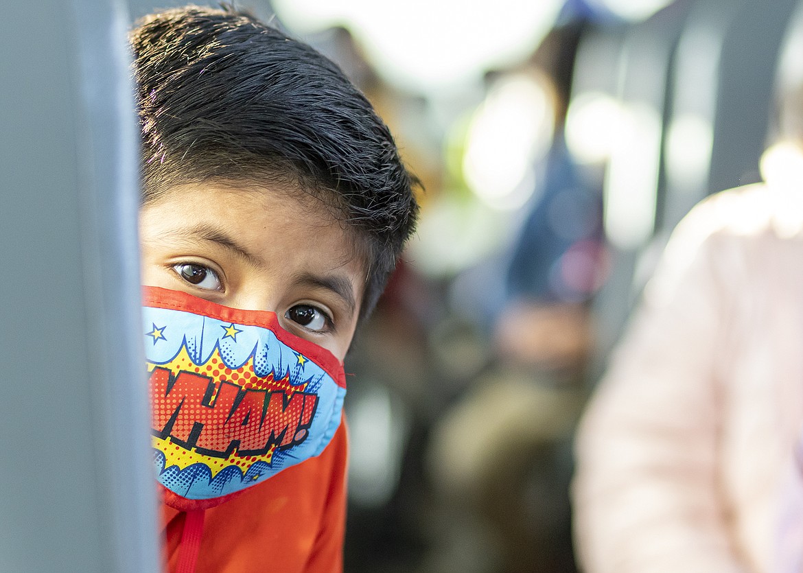 An Othello School District student rides the bus to school. District officials are looking for more bus drivers.