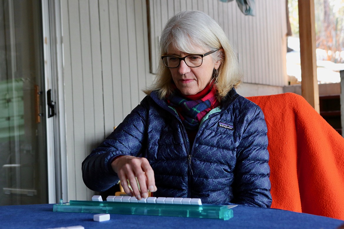 Guinevere Cummings prepares to exchange a tile during a round of mahjong near Echo Lake.
Mackenzie Reiss/Bigfork Eagle