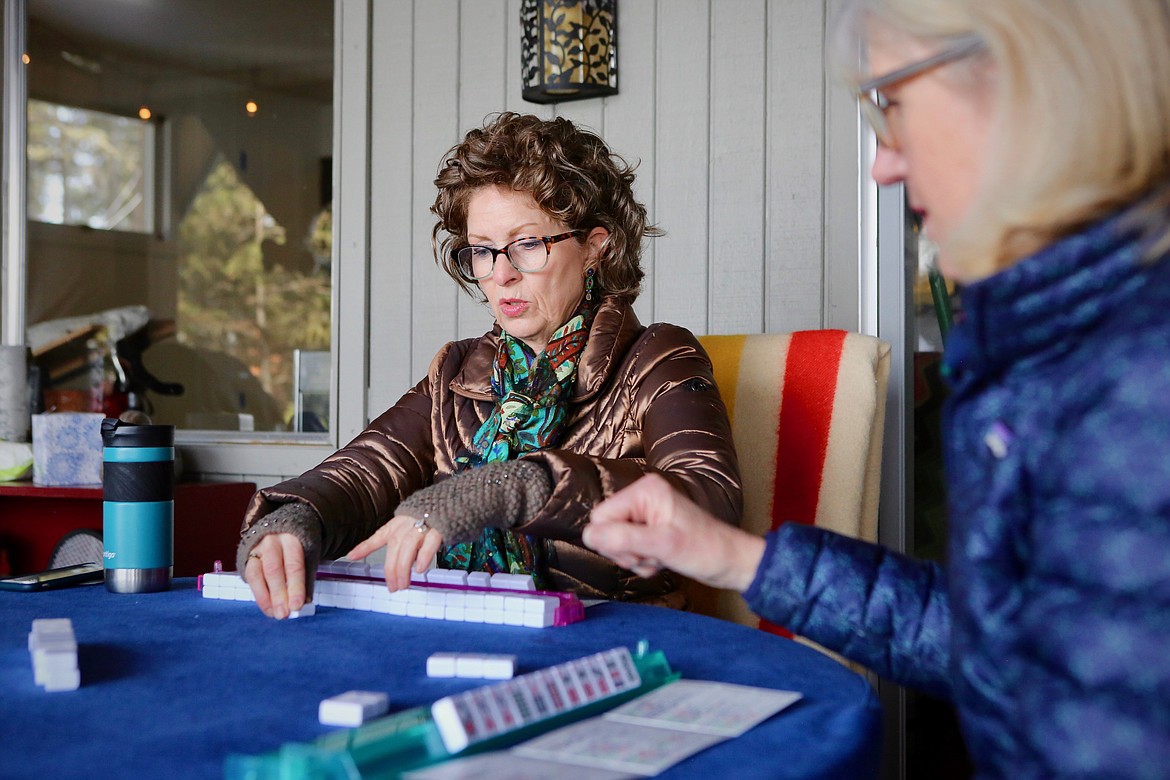 Candus Suppelsa plays mahjong Friday afternoon, March 12 at the home of Jan Thompson near Echo Lake.
Mackenzie Reiss/Bigfork Eagle