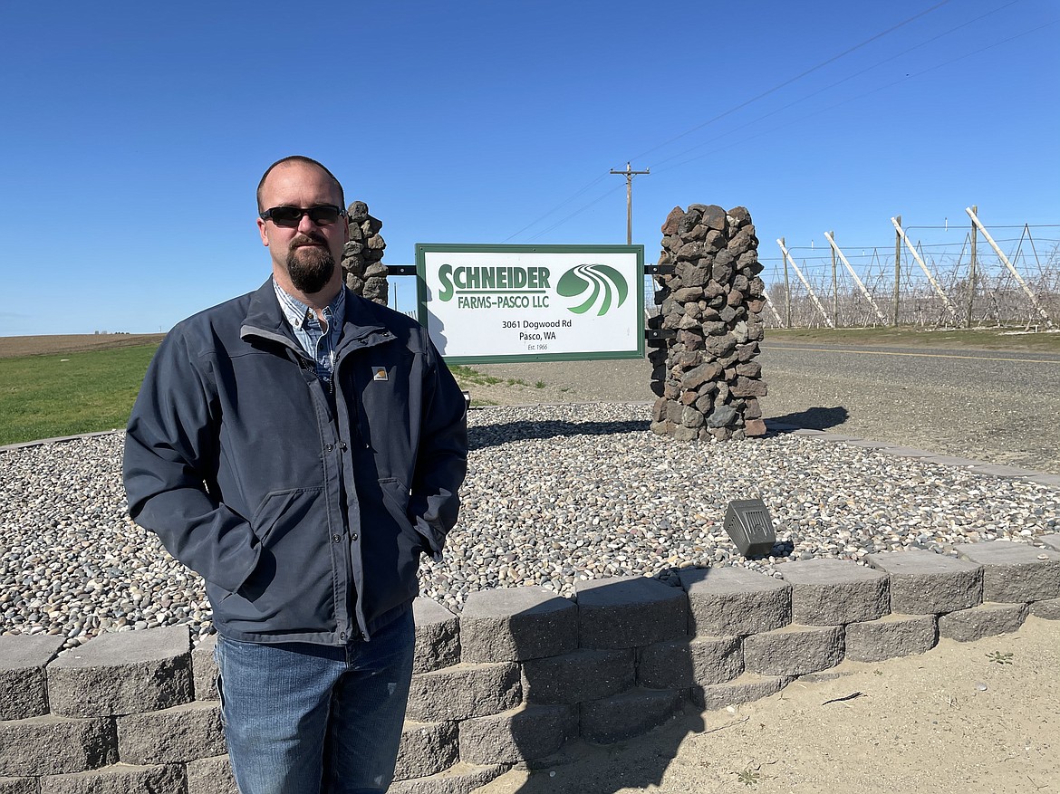 Grant Morris, a partner in Schneider Farms since 2005, in front of the business on a bright late winter day in mid-March. Schneider Farms typically begins planting potatoes in early March.