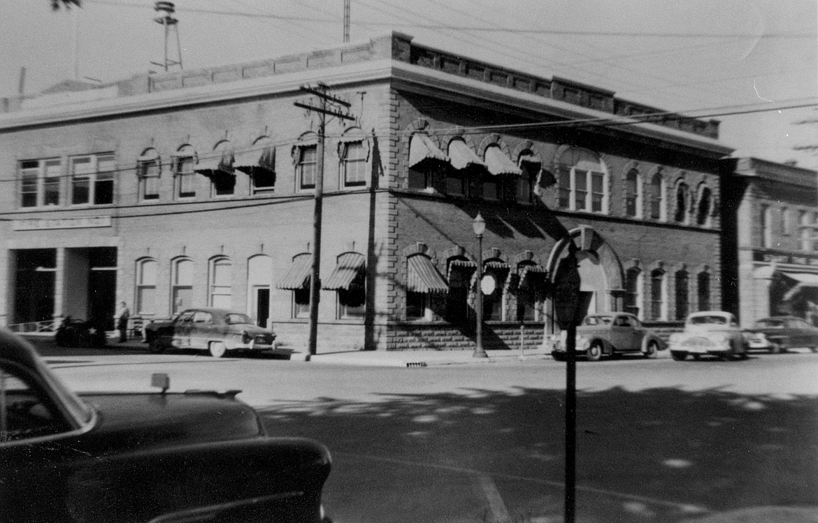 A photo of the old Sandpoint City Hall building showing the structure after the removal of the cupola and bell, which were removed in the winter of 1951-'52.