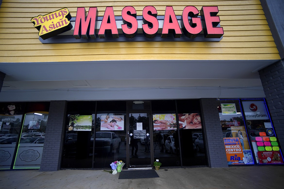 A make-shift memorial is seen outside a business where a multiple fatal shooting occurred on Tuesday, Wednesday, March 17, 2021, in Acworth, Ga. Robert Aaron Long, a white man, is accused of killing several people, most of whom were of Asian descent, at massage parlors in the Atlanta area.