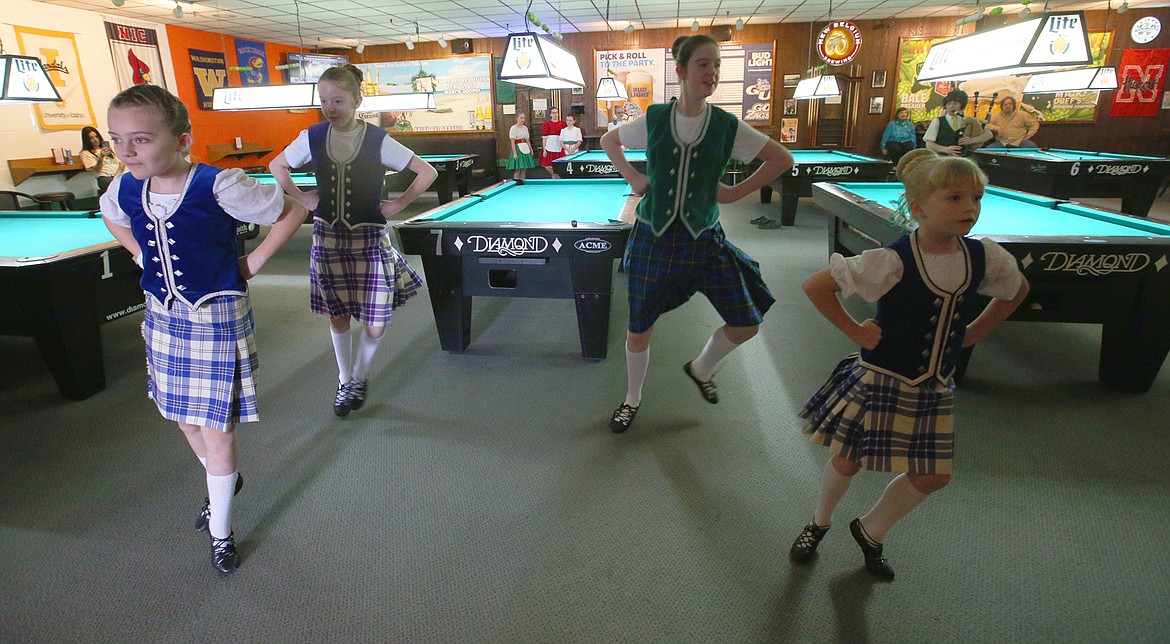 Olivia Dominguez, Bethany Hawkins, Vanya Handeen and Layla Handeen perform with the Lake City Highland Dancers on Wednesday at Paddy's Sports Bar.