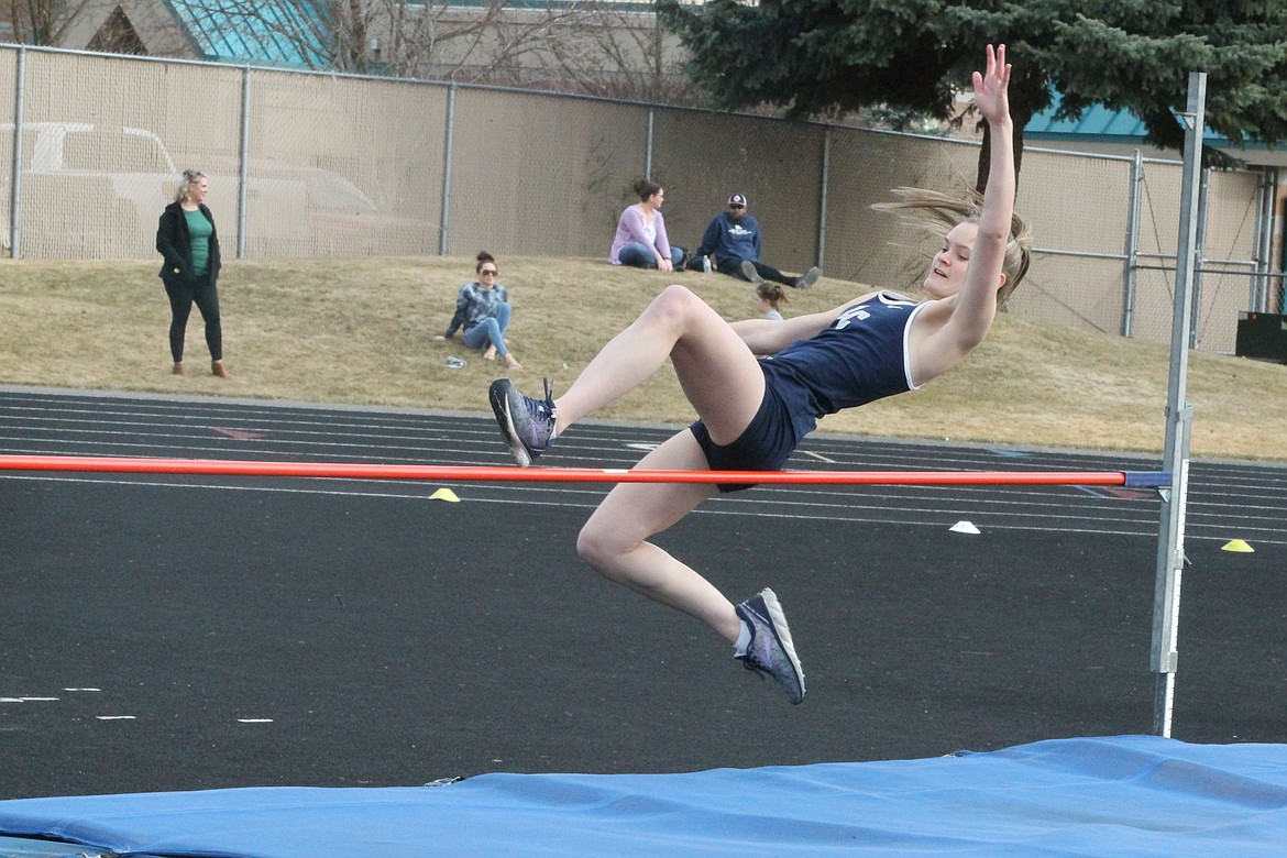 JASON ELLIOTT/Press
Lake City High junior Hailey Jo Parks attempts to get over the bar during a high jump attempt in Thursday's Battle for the Baton meet at Lake City High.