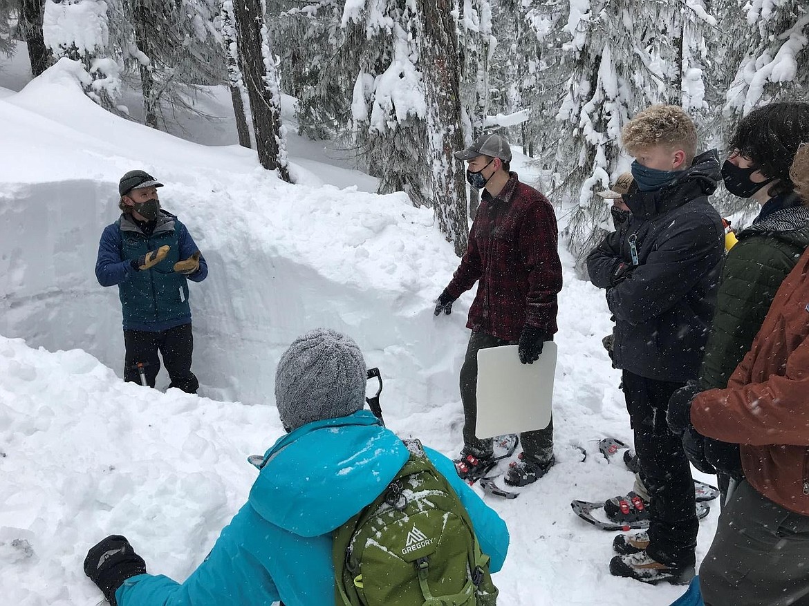 Lake City teacher Jamie Esler gives an avalanche safety demonstration.