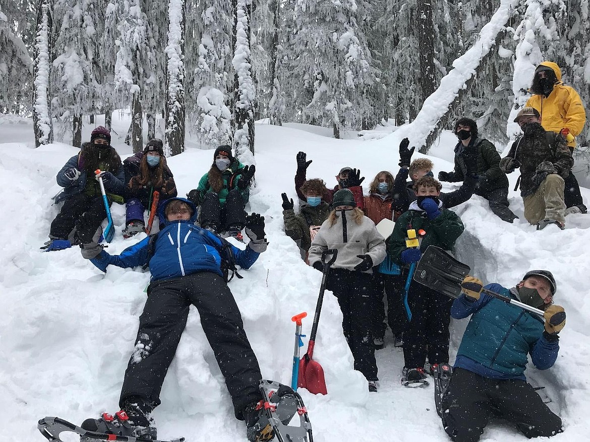 Students celebrate finishing their snowpack measurements.