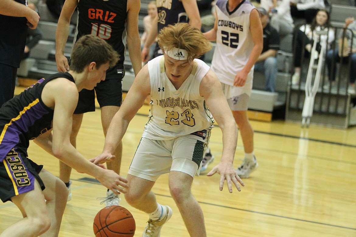 JASON ELLIOTT/Press
St. Maries senior Eli Gibson and Cascade's Blake Thurston attempt to corral a rebound during the fourth quarter of Saturday's 17th annual Idaho High School All-Star Game at Post Falls High.