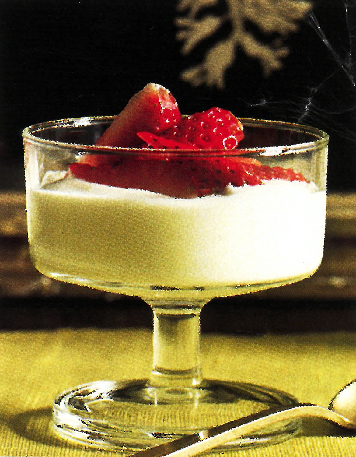 Strawberries enhance the elegance of white chocolate mousse.