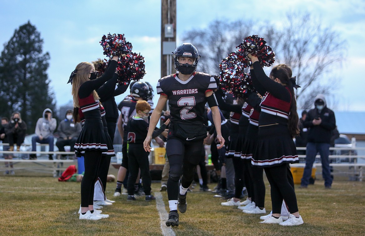 ACH junior Parker Roberts heads out of the cheerleader tunnel before the game against Bridgeport on Friday night at Almira-Coulee-Hartline High School.