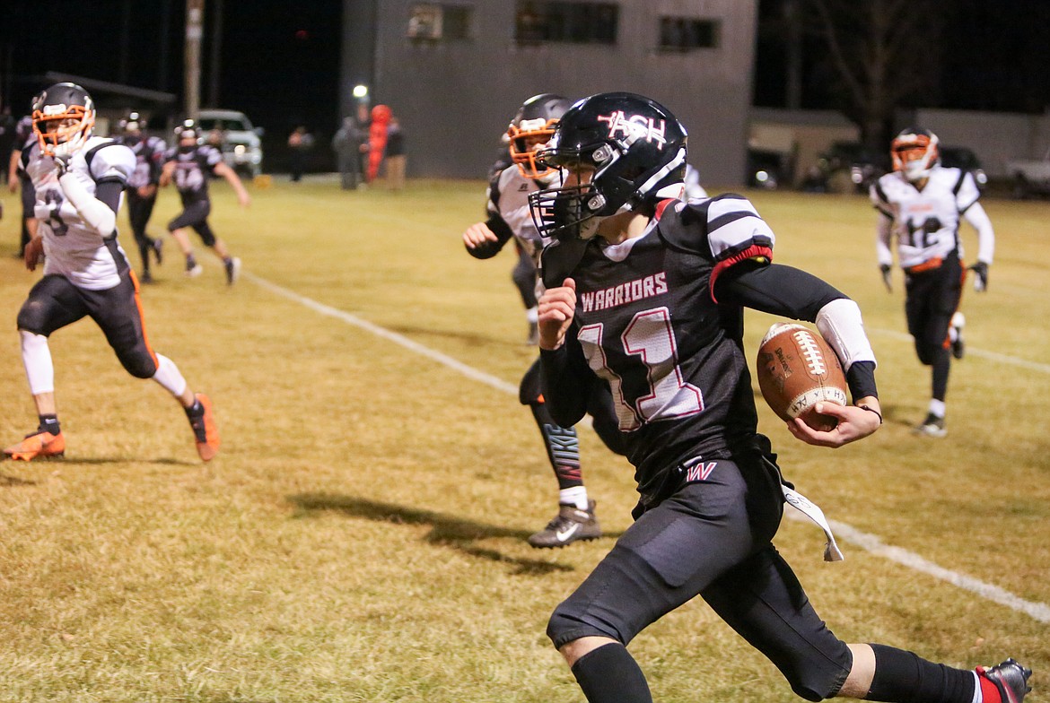 ACH's Cody Allsbrook runs down the sideline in the second half of the Warriors' win against Bridgeport on Friday night.