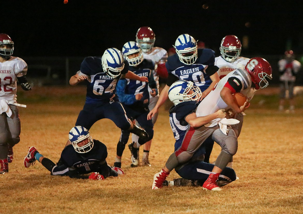 Soap Lake senior Dawson Kilmer fights to take down the Waterville rusher in the final minutes of the fourth quarter on Thursday night at Soap Lake High School.