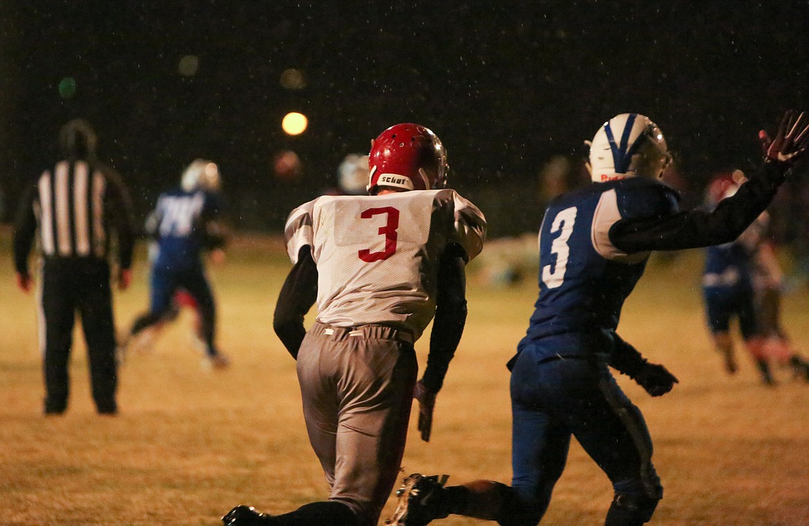 Soap Lake's Axel Soltero waves for the pass in the end zone in the second half on Thursday night at Soap Lake High School.