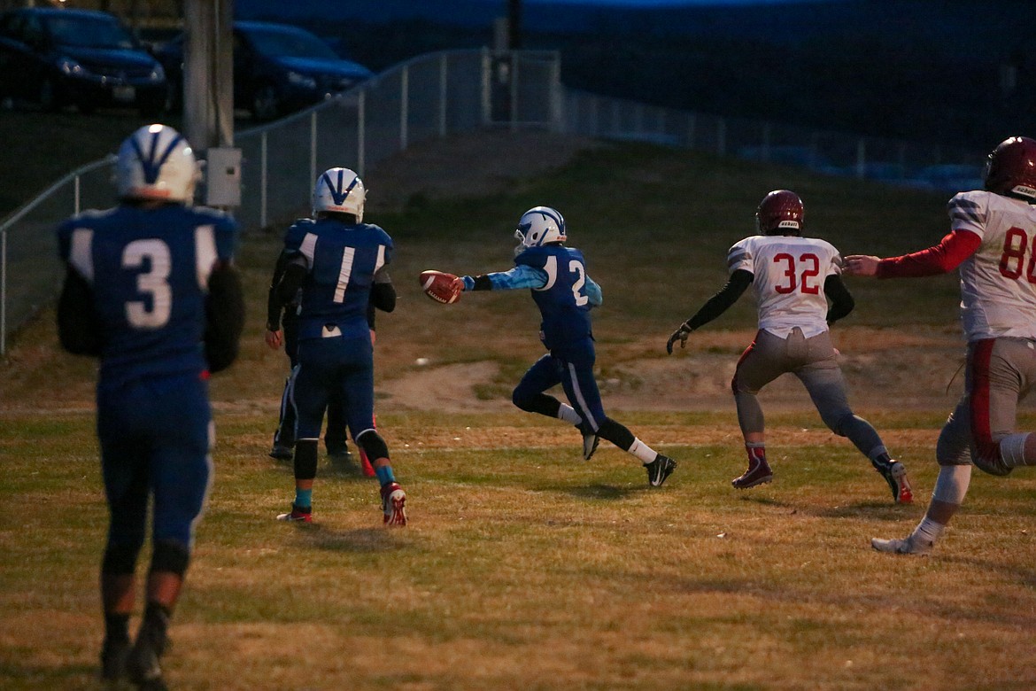 Soap Lake's Diego Garza reaches past the pylon as he makes his way in for the rushing touchdown on Thursday night at Soap Lake High School.