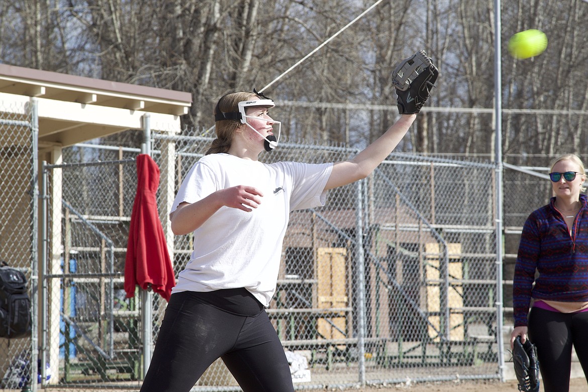 Junior Taylor Munro catches a ball at first base during a March 18 softball practice. (Will Langhorne/The Western News)