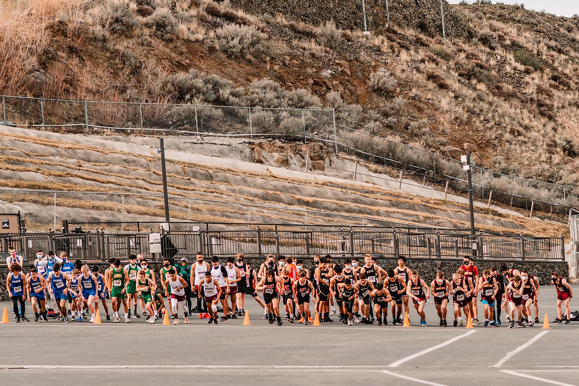 Runners leave the starting line in masses as the boys 5,000 Meter Cross Country meet kicks off at the Gorge Amphitheater in George on Saturday afternoon.