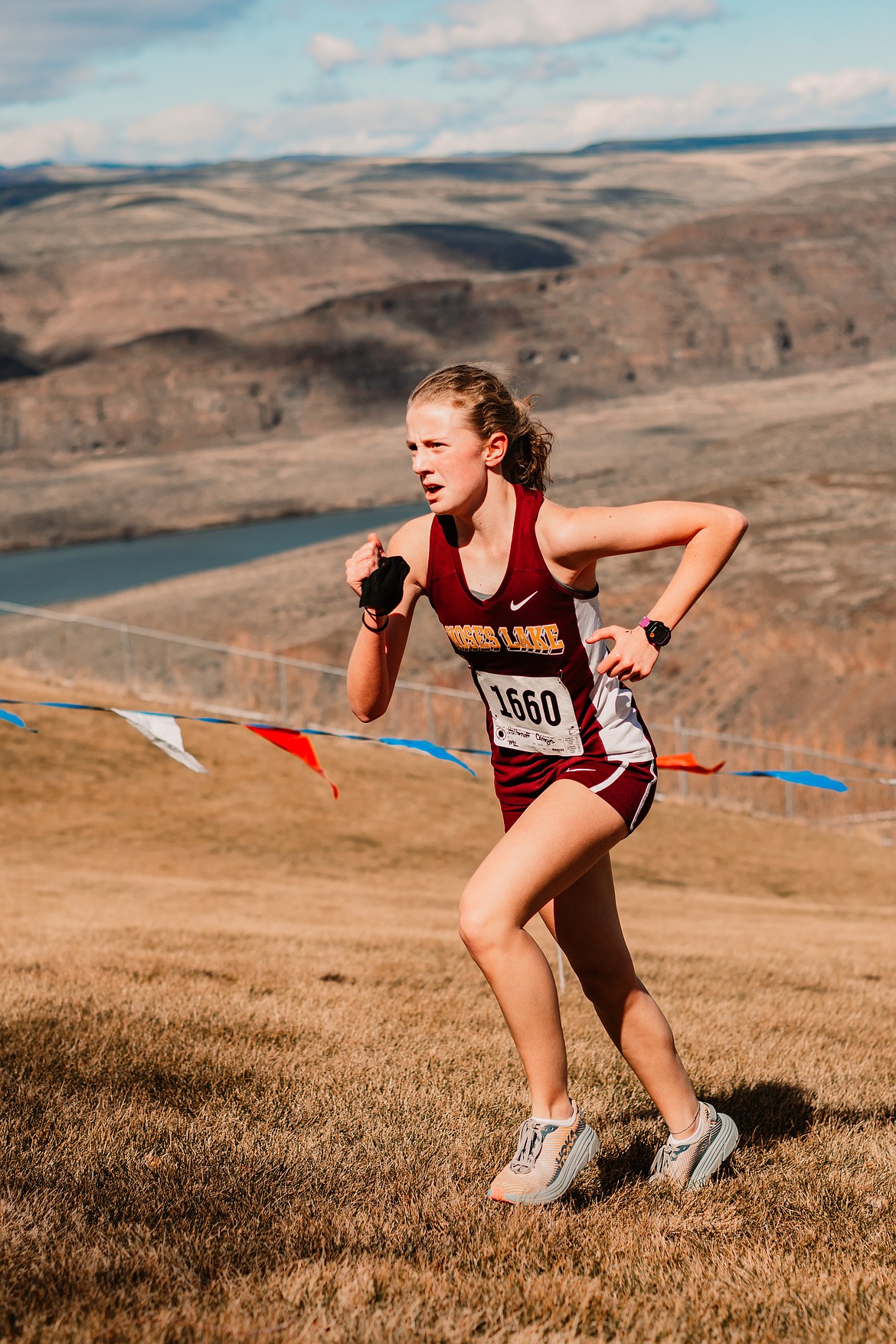 Moses Lake captain Camryn Holterhoff climbs the elevation at the 5,000 meter event at the Gorge Amphitheater on Saturday in George.