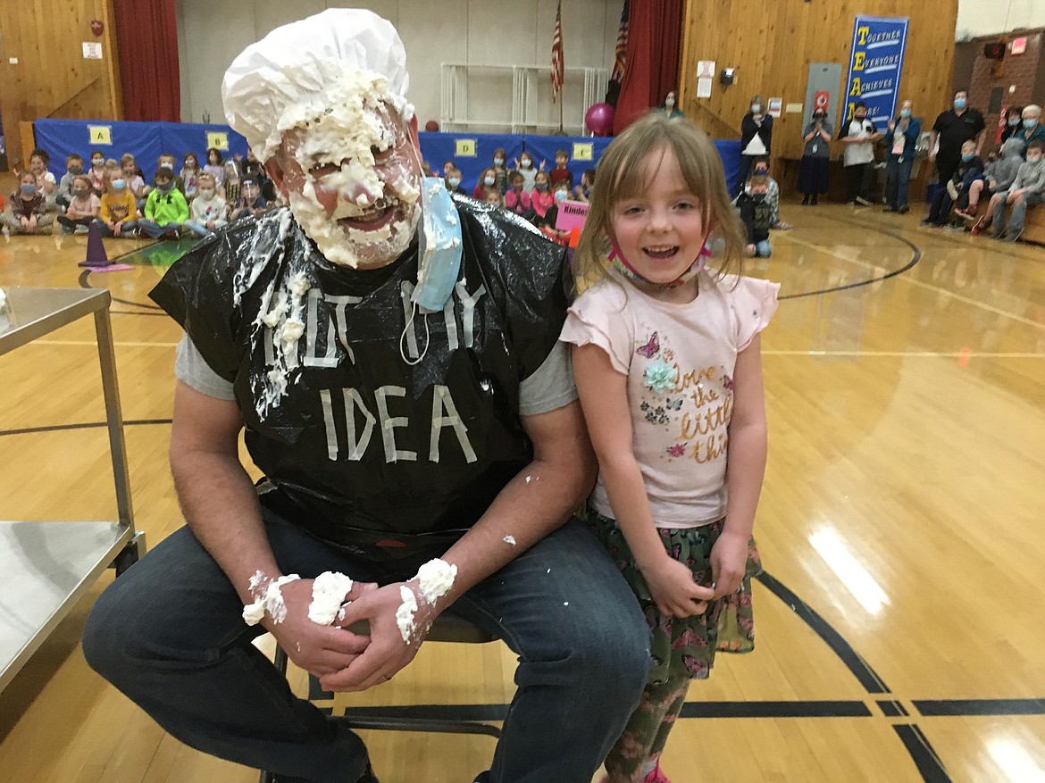 Pinehurst Elementary School Principal Mike Groves (the pie-ee) sits next to PES kindergartner Carmon Sauer (the pie-er). Groves took the pie in the face as a reward for a school-wide fundraiser for the American Heart Association. The students needed to raise $2,000 to hit their goal (literally) and once they did they held an assembly for the whole school to watch both Groves and PES PE Teacher Callie Hegbloom get pied.