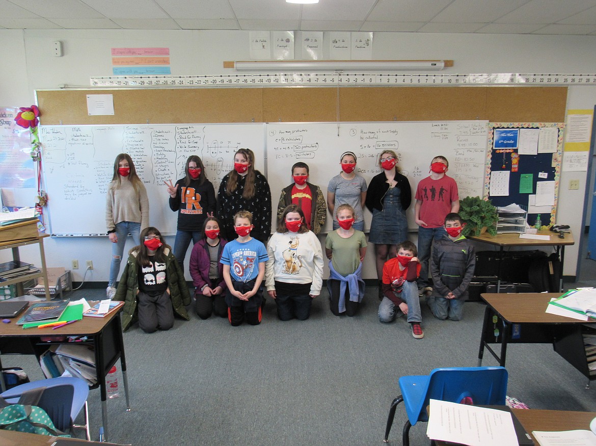 Students in Wilma Hahn's sixth grade class pose for a photo wearing their "Bulldog pride" masks.