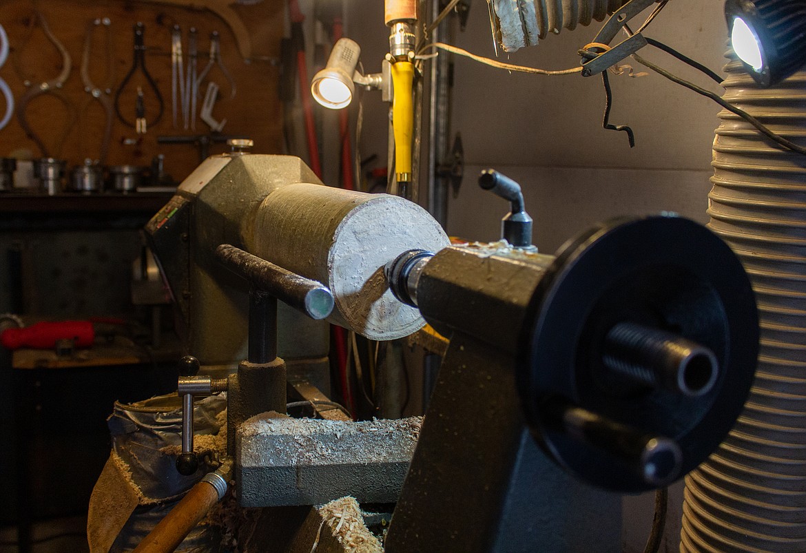 A piece of wood sits ready to turn on Merle Hardy's wood lathe in his garage in Moses Lake on Monday afternoon.