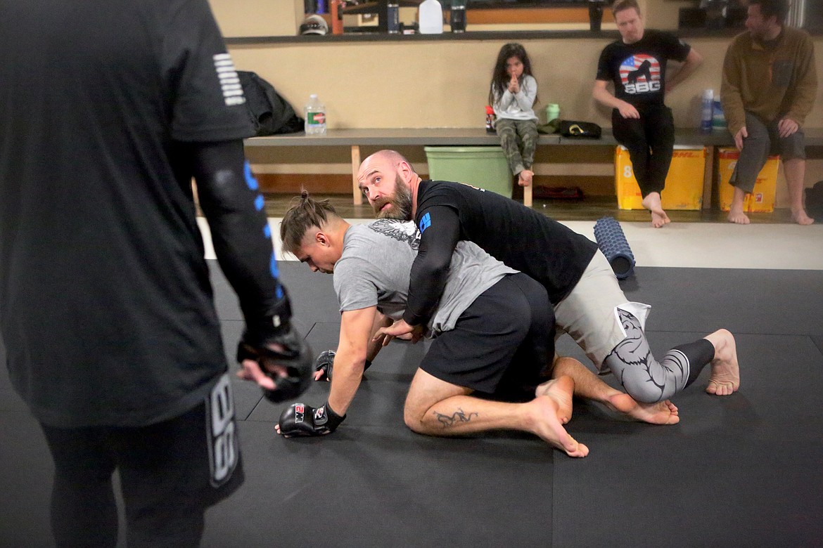 Cody Bessette demonstrates a hold during an early morning class at SBG Kalispell on Monday, March 22.
Mackenzie Reiss/Bigfork Eagle