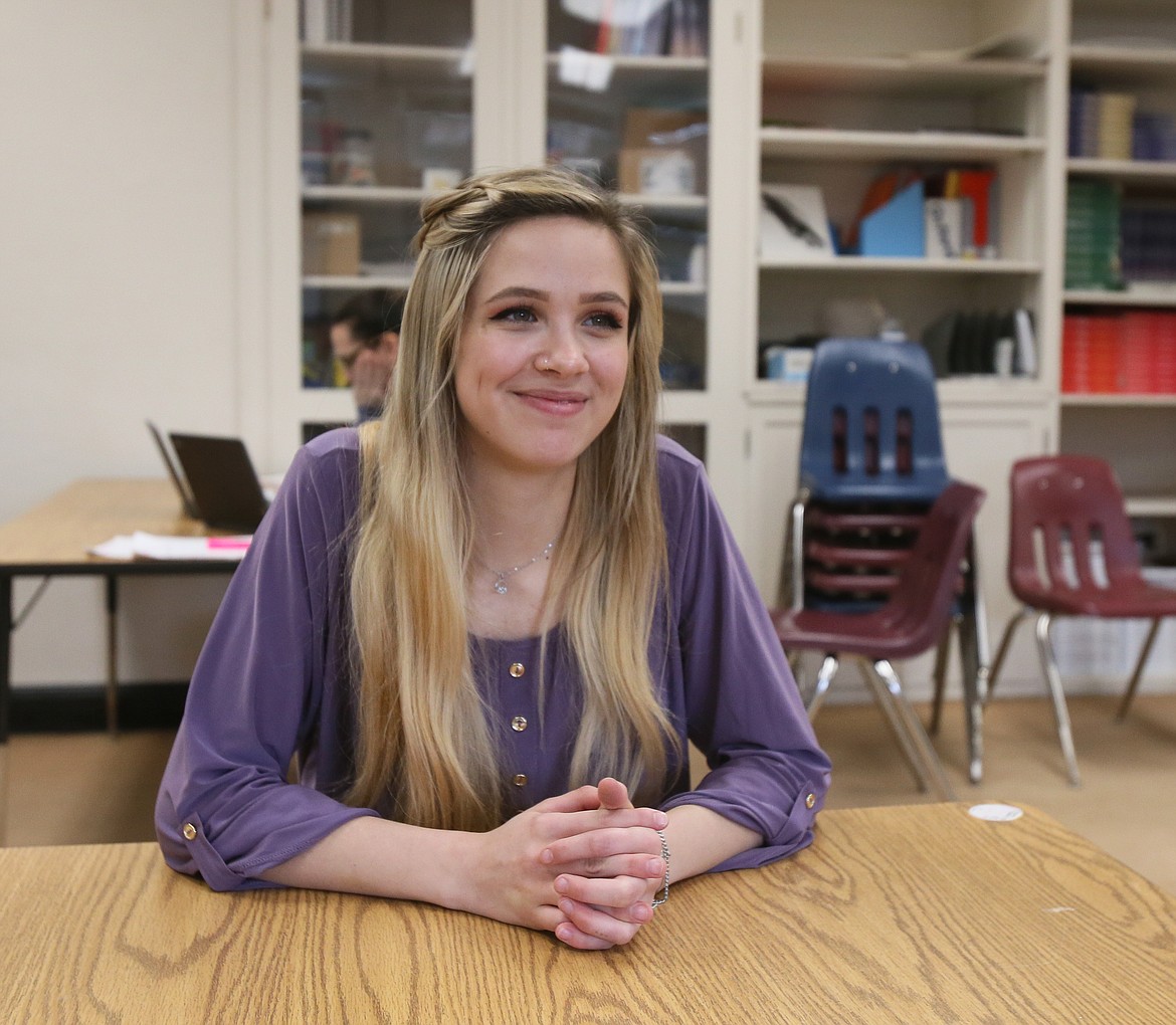 Madison Brunke smiles Tuesday as she thinks about her future as a photographer during Mountain View Senior High School's Senior Career Interviews. Students were paired with community members in seven-minute sessions to share knowledge and ask questions regarding their potential career paths.