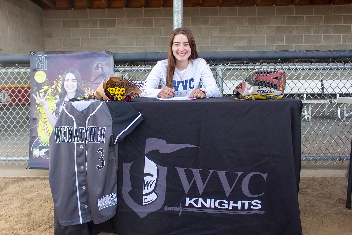 Moses Lake's Ciarrah Knoll smiles as she signs to play next softball next season at Wenatchee Valley College on Wednesday afternoon at Moses Lake High School.