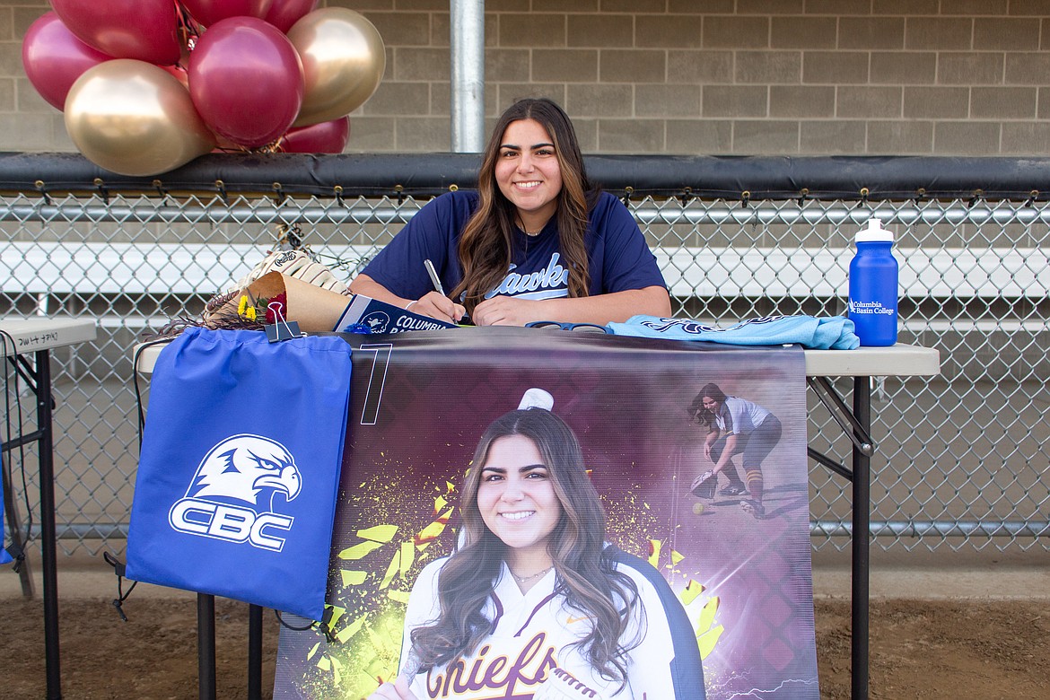 Moses Lake senior Madi Olson secured another two years of softball on Wednesday afternoon as she signed to play next fall at Columbia Basin College at MLHS.