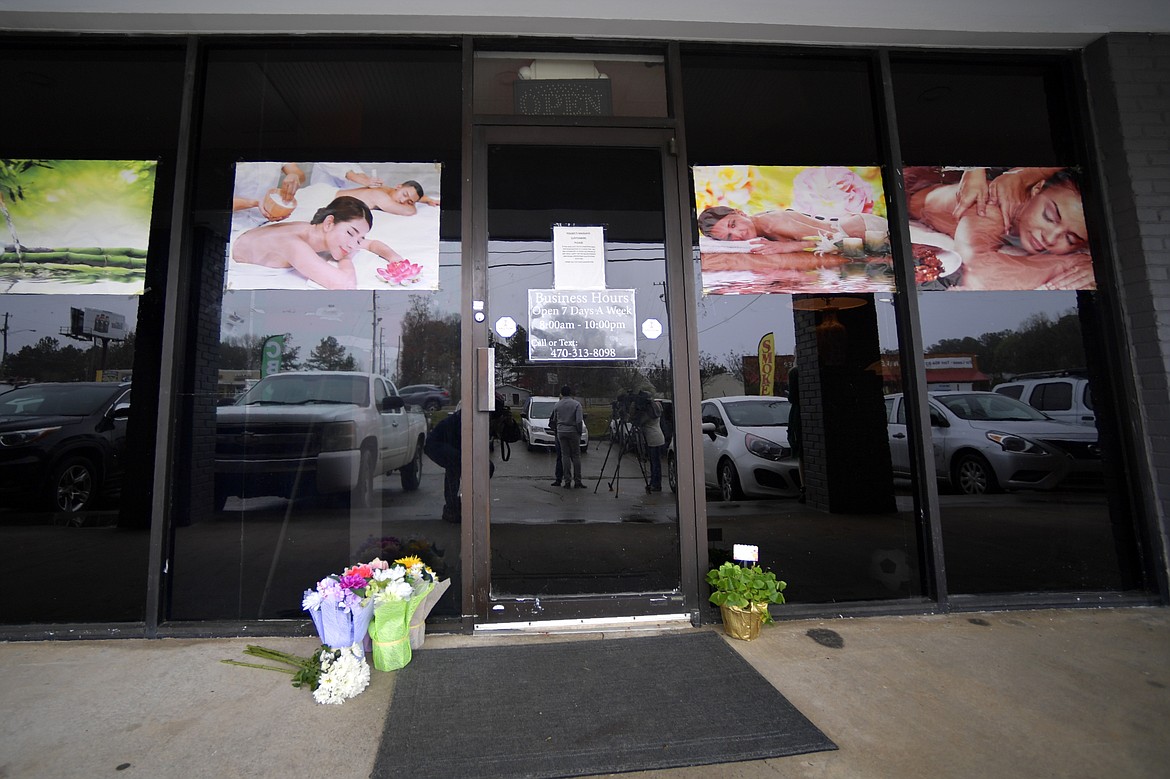 A make-shift memorial is seen outside a business where a multiple fatal shooting occurred on Tuesday, Wednesday, March 17, 2021, in Acworth, Ga. Robert Aaron Long, a white man, is accused of killing several people, most of whom were of Asian descent, at massage parlors in the Atlanta area.