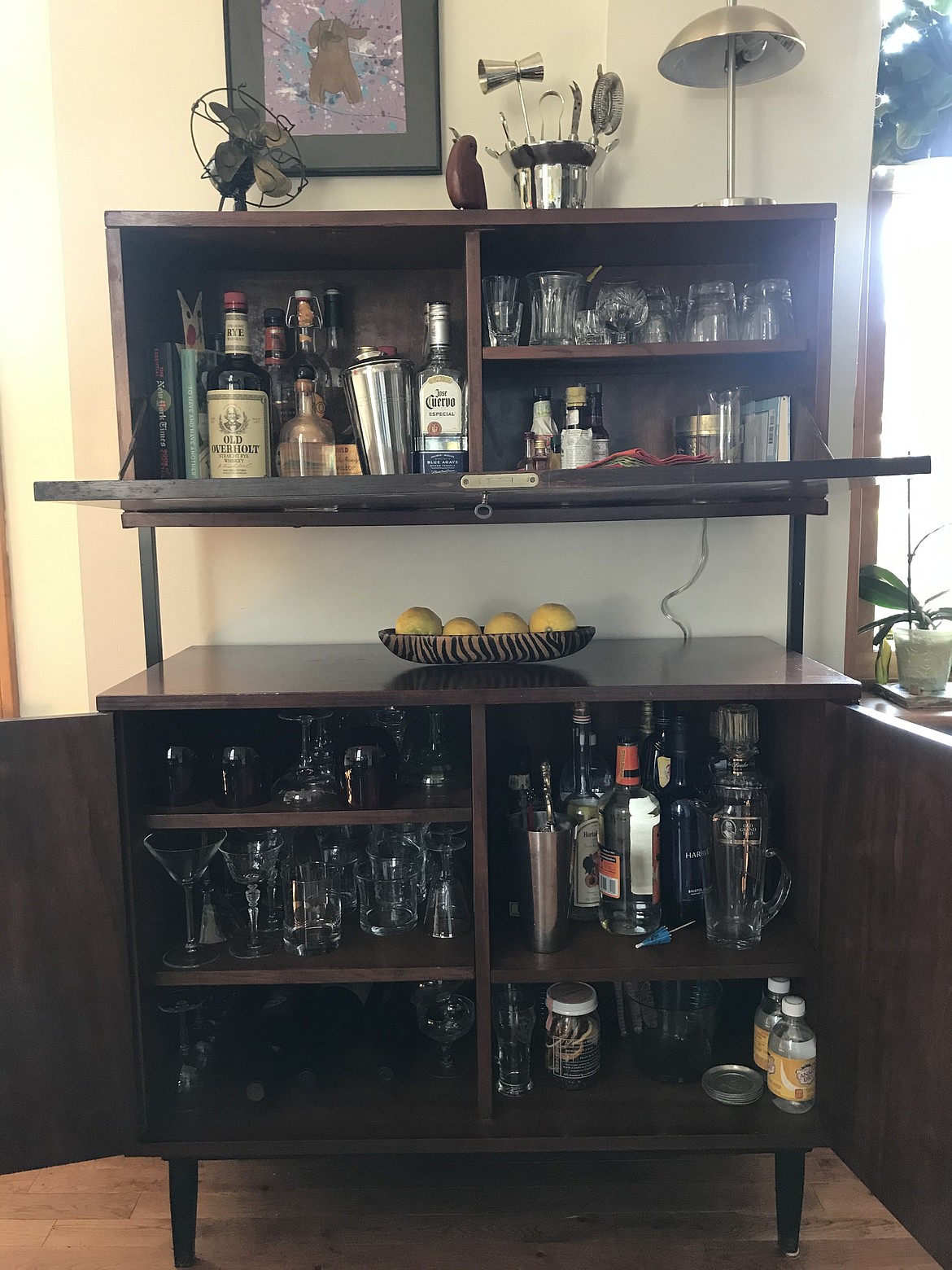 Valerie Schremp Hahn and her husband Andy found the wood cabinet pieces of this bar for $50 at a thrift store and pieced it together to make a home bar.