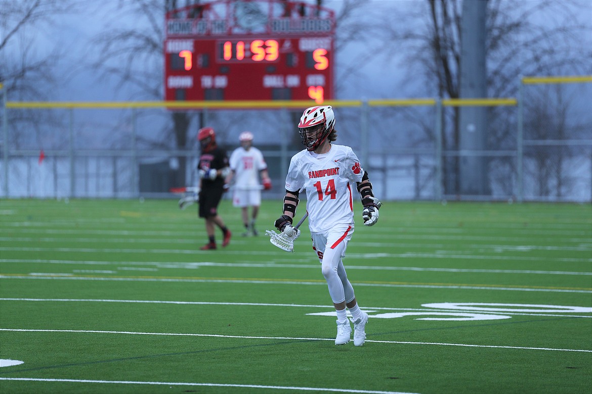 Joseph Aexel crosses midfield with the ball after winning a faceoff on Wednesday.