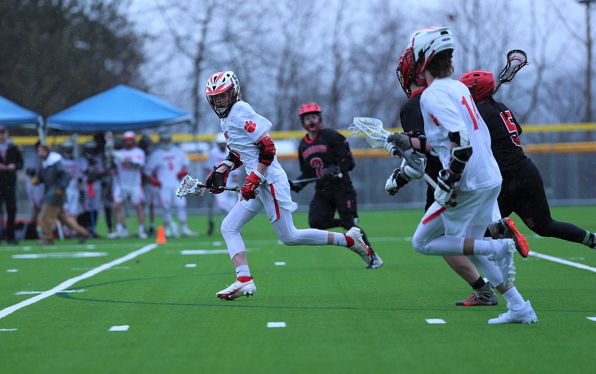 Sawyer Treadaway charges upfield after winning a faceoff on Wednesday.