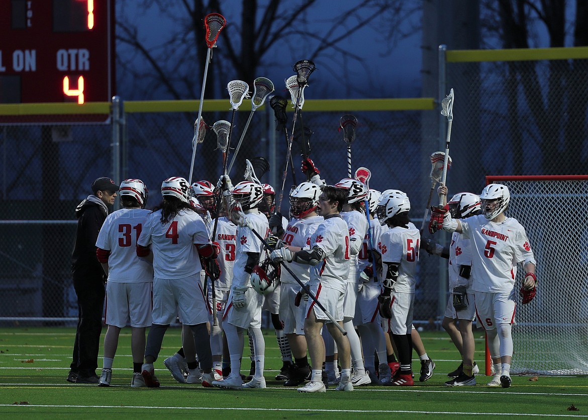 Sandpoint celebrates after defeating Moscow 11-7 on Wednesday.