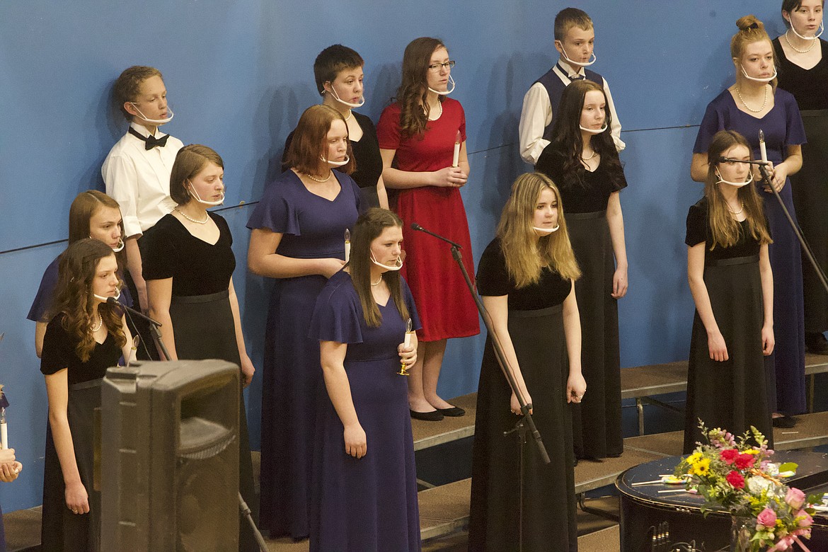 Members of the Libby High School and Middle School choirs sing at a March 24 concert in the Ralph Tate Gym. (Will Langhorne/The Western News)