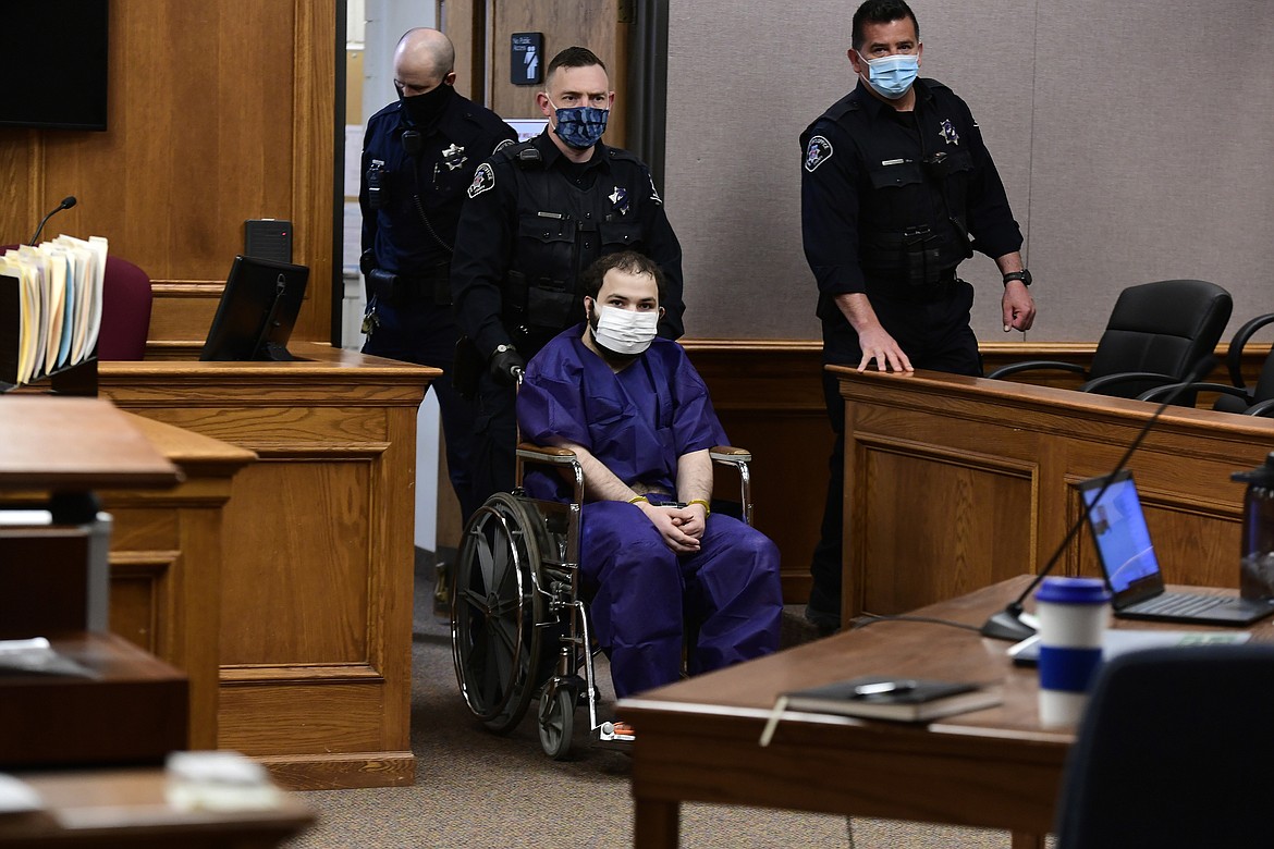 Ahmad Al Aliwi Alissa, 21, appears before Boulder District Court Judge Thomas Mulvahill at the Boulder County Justice Center in Boulder, Colo. on Thursday, March 25, 2021. Three days after he was led away in handcuffs from a Boulder supermarket where 10 people were fatally shot, Alissa appeared in court for the first time and his defense lawyer asked for a mental health assessment "to address his mental illness."