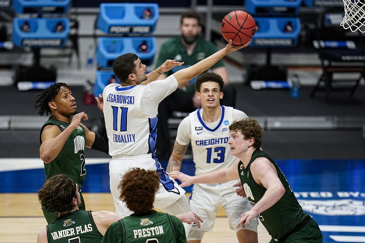 MICHAEL CONROY/Associated Press
Creighton guard Marcus Zegarowski (11) shoots over Ohio forward Colin Granger (32) in a second-round game in the NCAA tournament Monday at Hinkle Fieldhouse in Indianapolis.