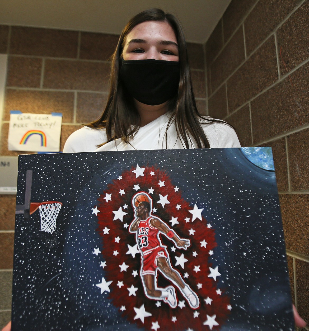 Brooklyn Rewers on Tuesday showcases her unique take on basketball hero Michael Jordan's epic dunks. The Lake City High School honors art student painted this as part of an independent project.