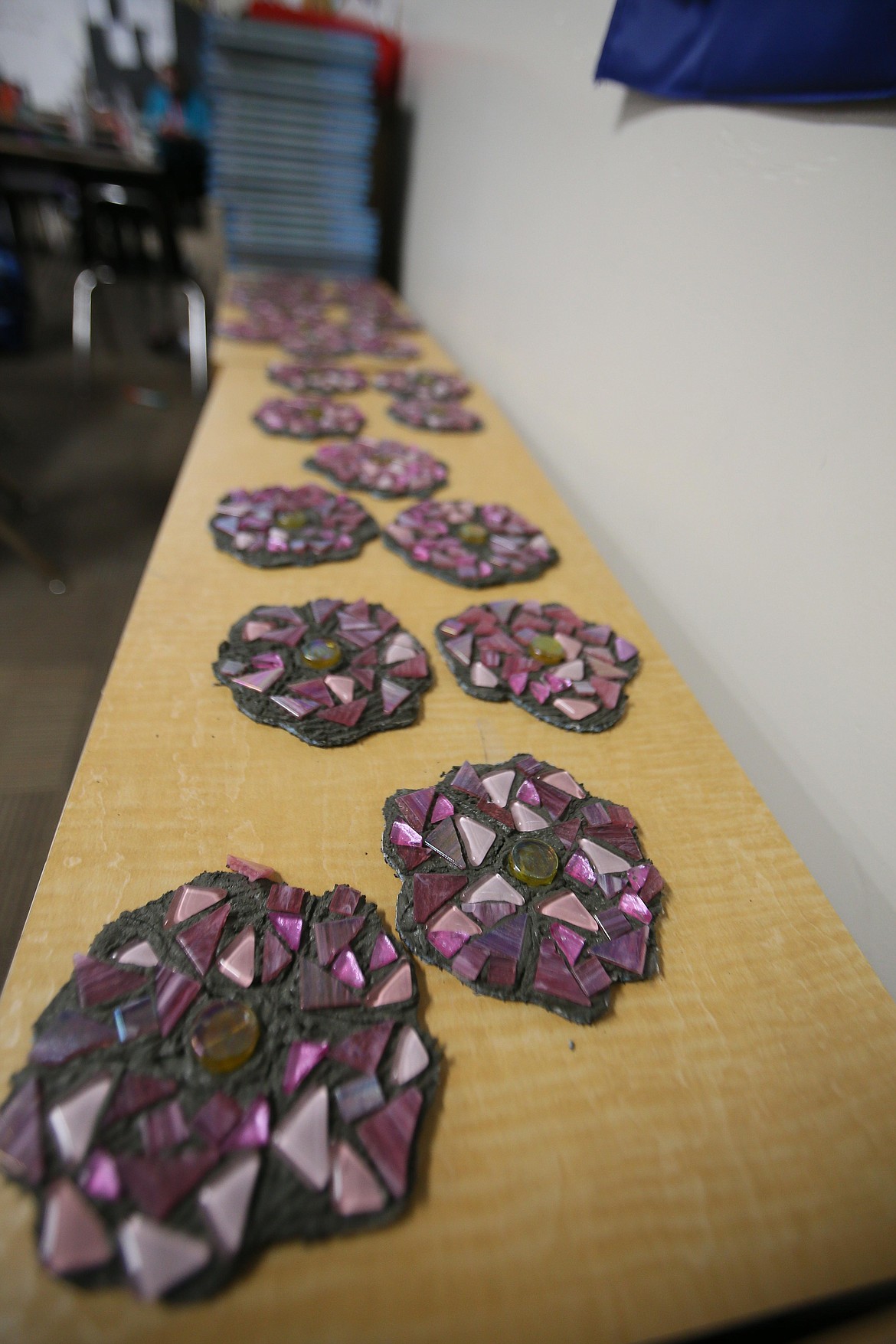 Wild rose mosaic pieces created in Heather Schreiber's third grade class will be added to the mural that will be installed on a wall outside of Sorensen Magnet School this spring.