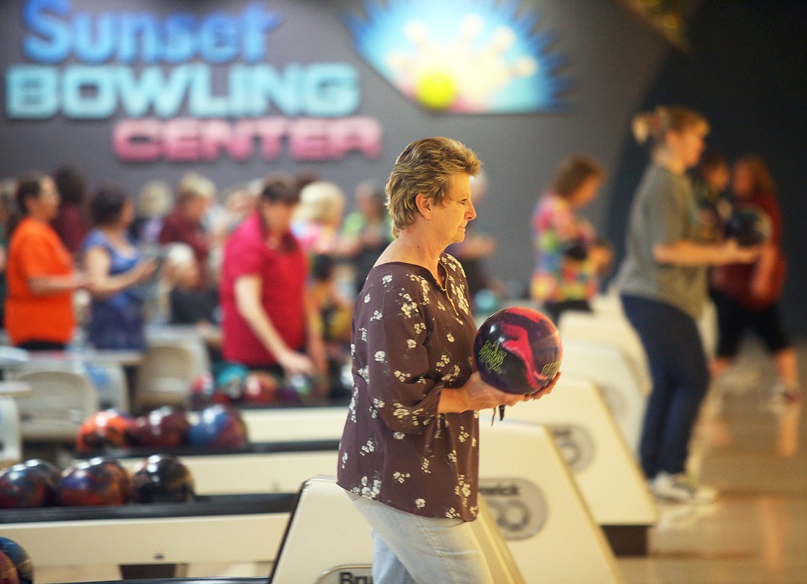 Patti Callison of Blackfoot focuses on her approach during the first day of the Idaho state women's bowling tournament at Sunset Bowling Center on Saturday.