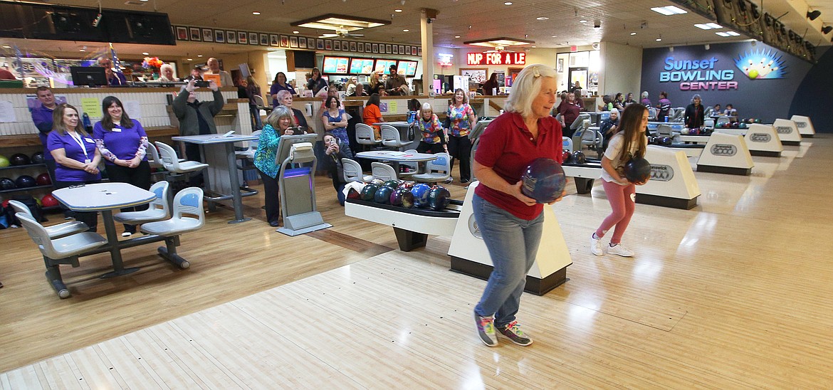 Chris Pappas, left, and Rosy Gallegos make the honorary opening throws of the Idaho state women's bowling tournament at Sunset Bowling Center on Saturday