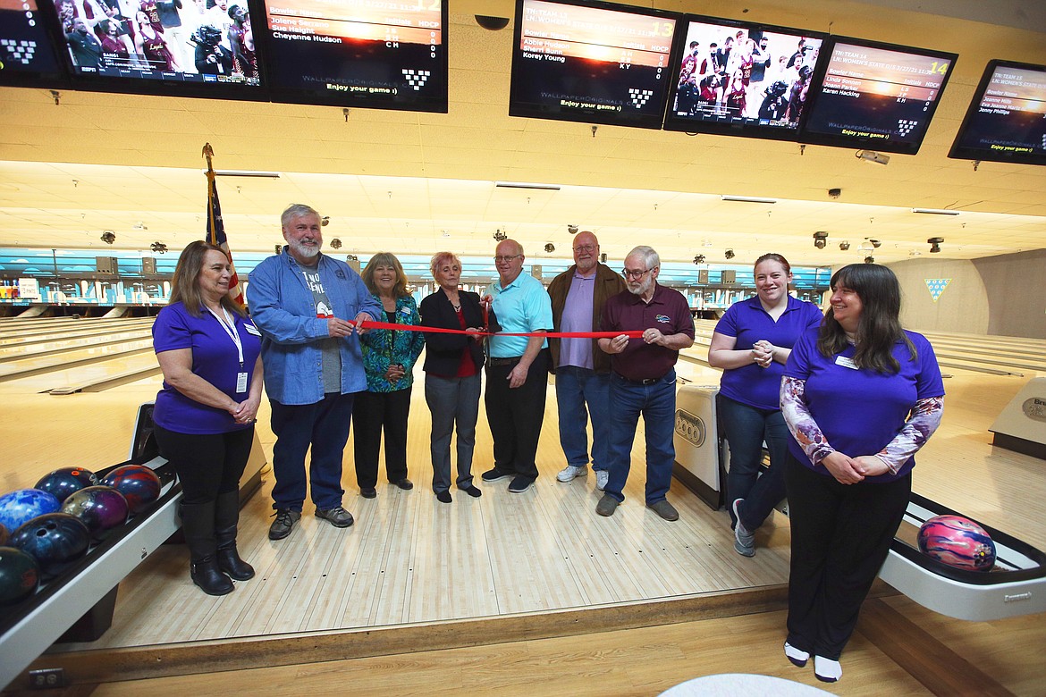 The ribbon is cut during the opening ceremony of the Idaho state women's bowling tournament at Sunset Bowling Center on Saturday. From left are Cathy Moruzzi, Rathdrum Mayor Vic Holmes, Post Falls Councilwoman Kerri Thoreson, Elaine Faddis, Wally Studer, Hayden City Councilman Roger Saterfiel, Coeur d'Alene City Councilman Dan English, tournament director Shelby Thompson and Jackie Montgomery.