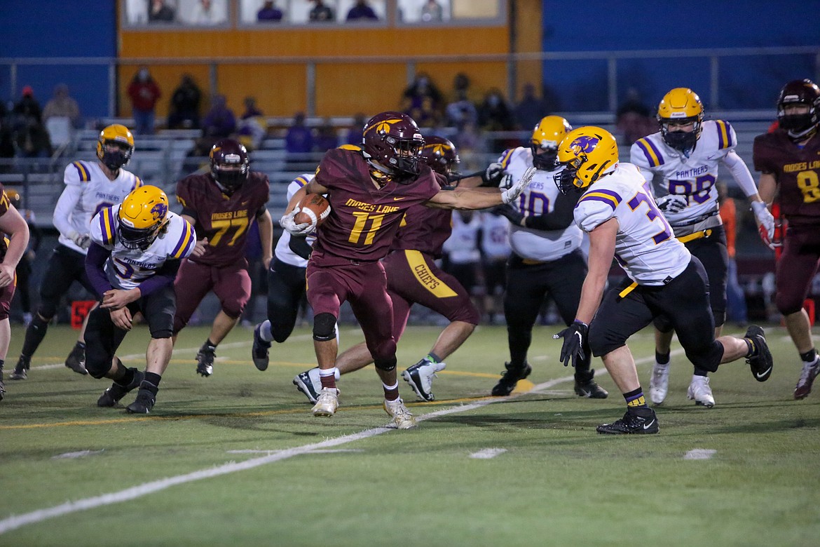 Moses Lake running back Sergio Guzman makes the cut upfield in the second half against Wenatchee on Friday night at Lions Field.