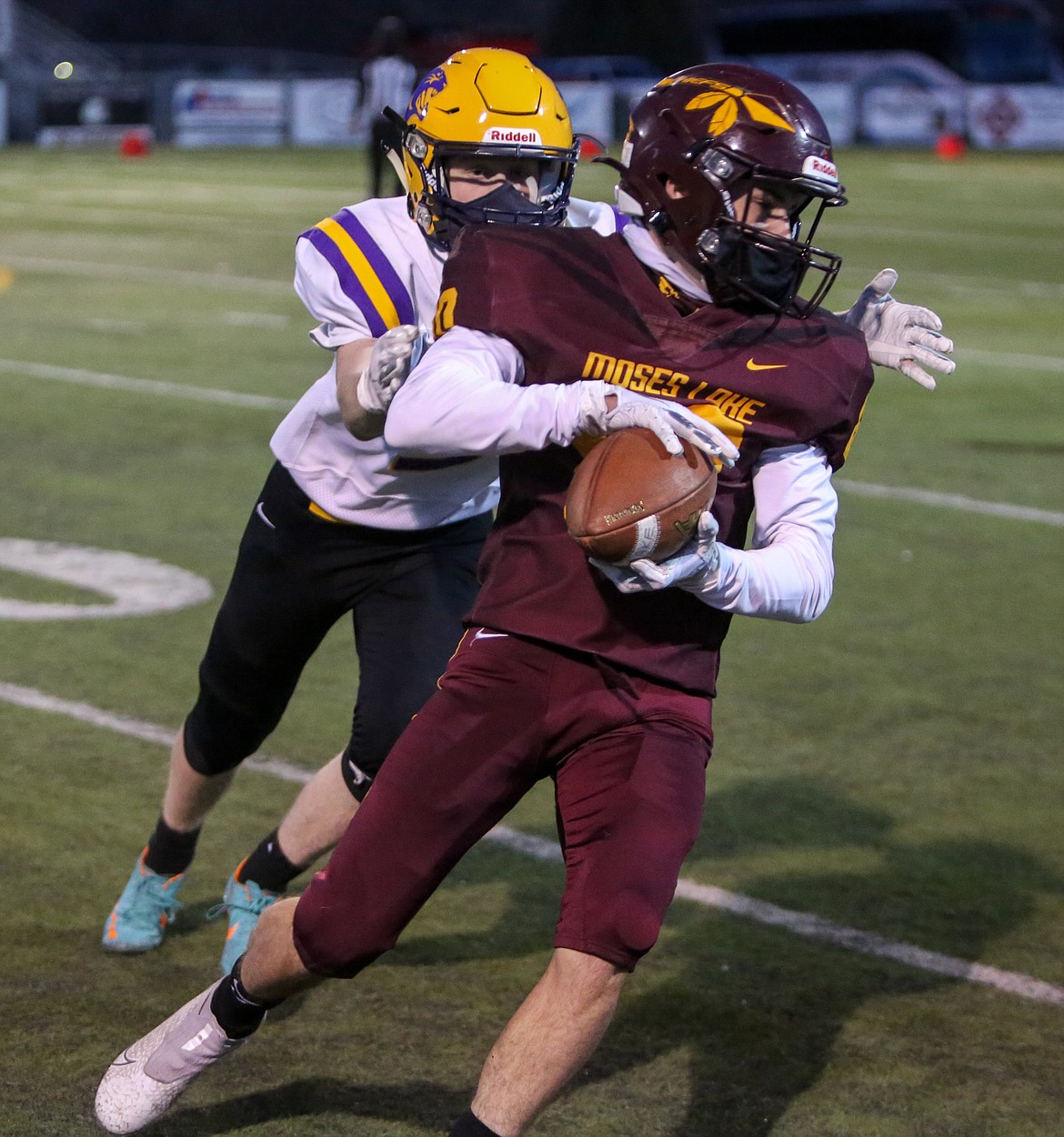 Brandon Johnson hauls in the catch for Moses Lake near the sideline against Wenatchee on Friday night at Lions Field.