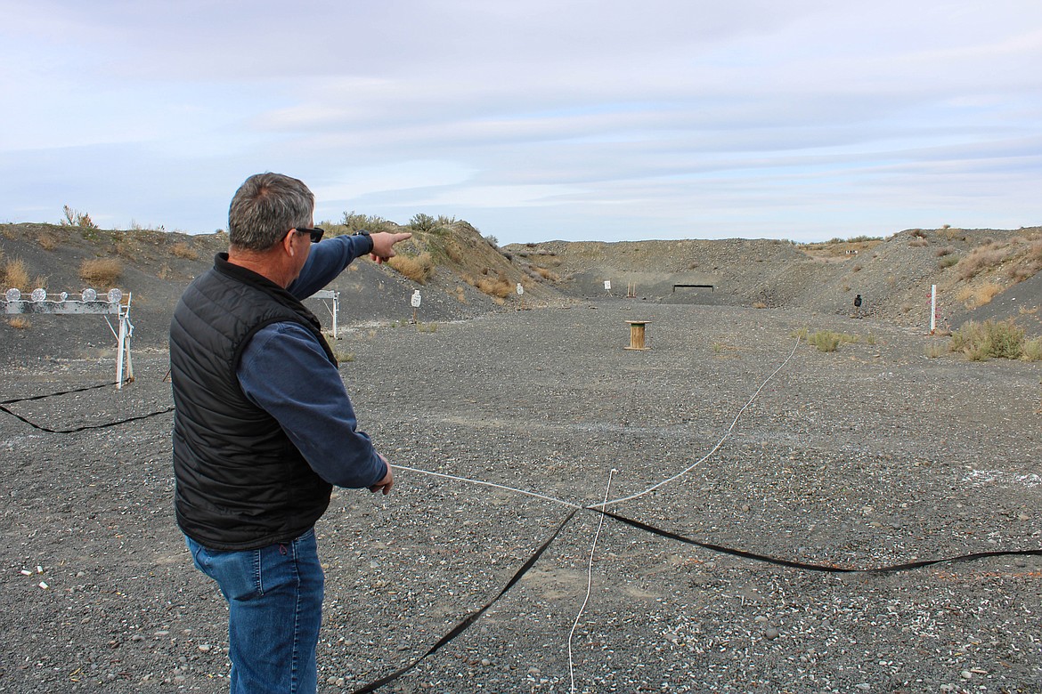 Ephrata Sportsmen's Association President Mike DeTrolio pulls a rope to reset a rifle target at the Boyd Mordhorst Memorial Range on Saturday.