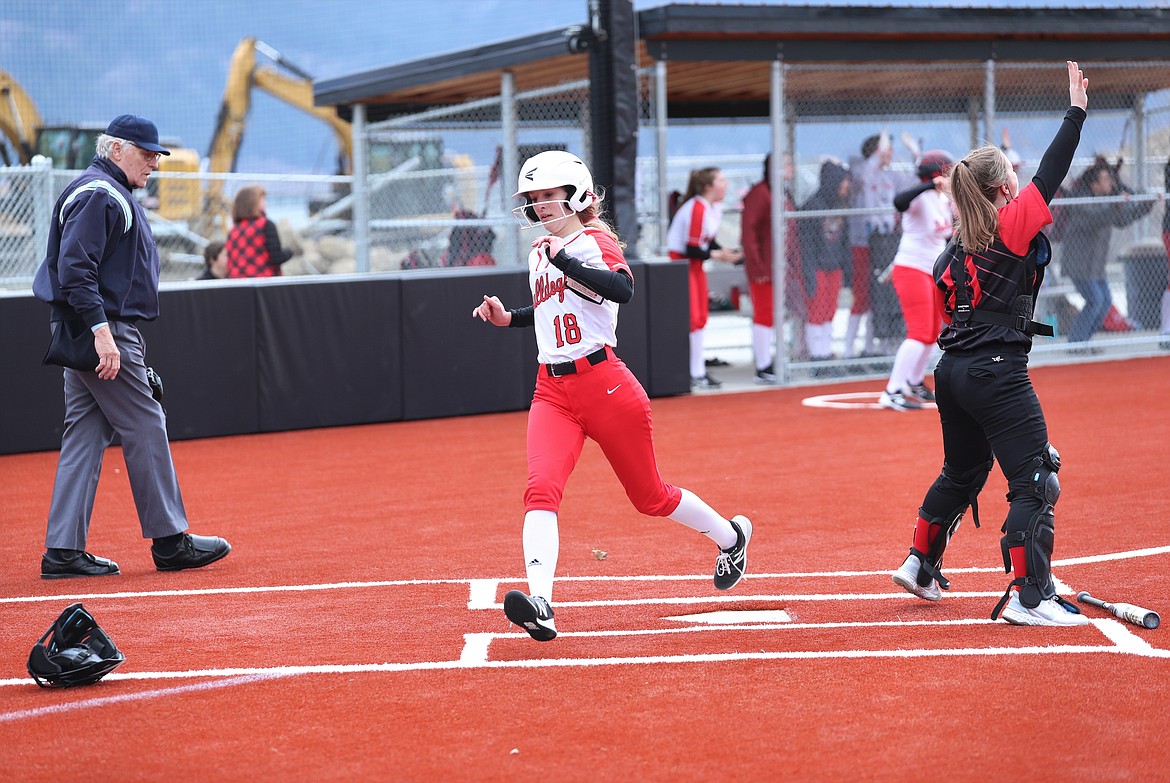 Jaidyn Inman crosses home plate on Saturday.