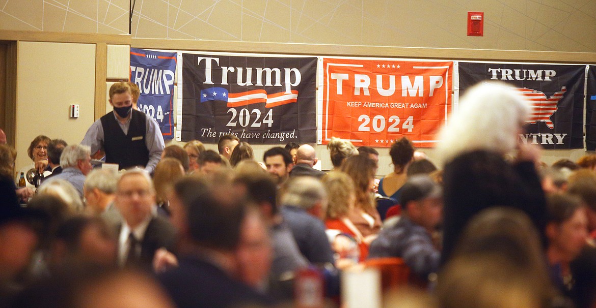 Signs supporting former President Donald Trump are displayed on the wall of the Kootenai County Republican Central Committee's Lincoln Day Dinner Saturday at The Coeur d'Alene Resort.